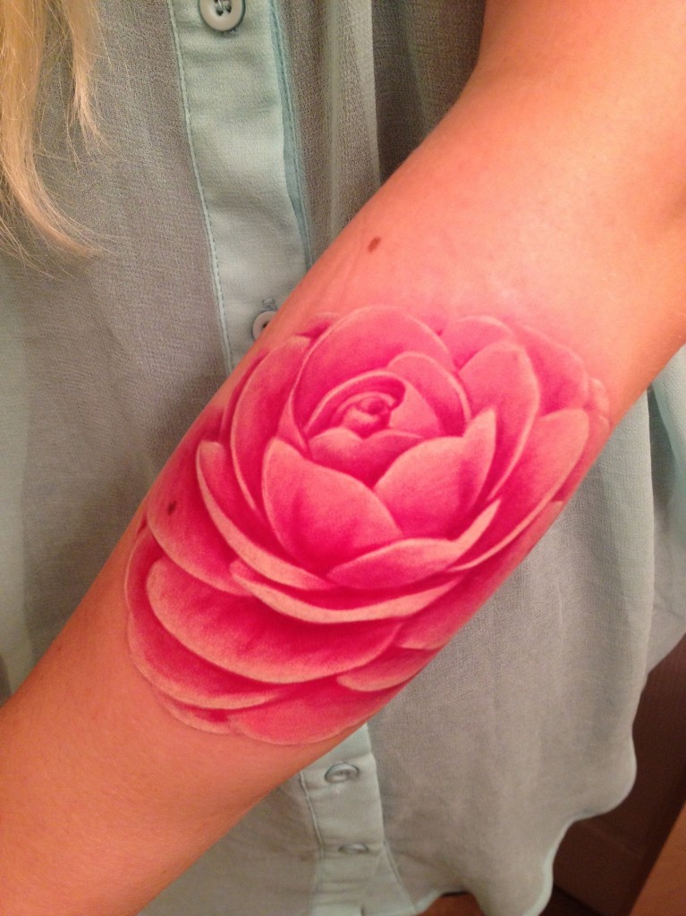 Pink Ink Lotus Flower Tattoo On Forearm