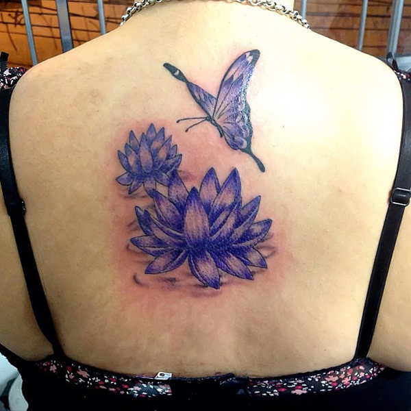 Purple Two Lotus Flowers With Butterfly Tattoo On Girl Upper Back