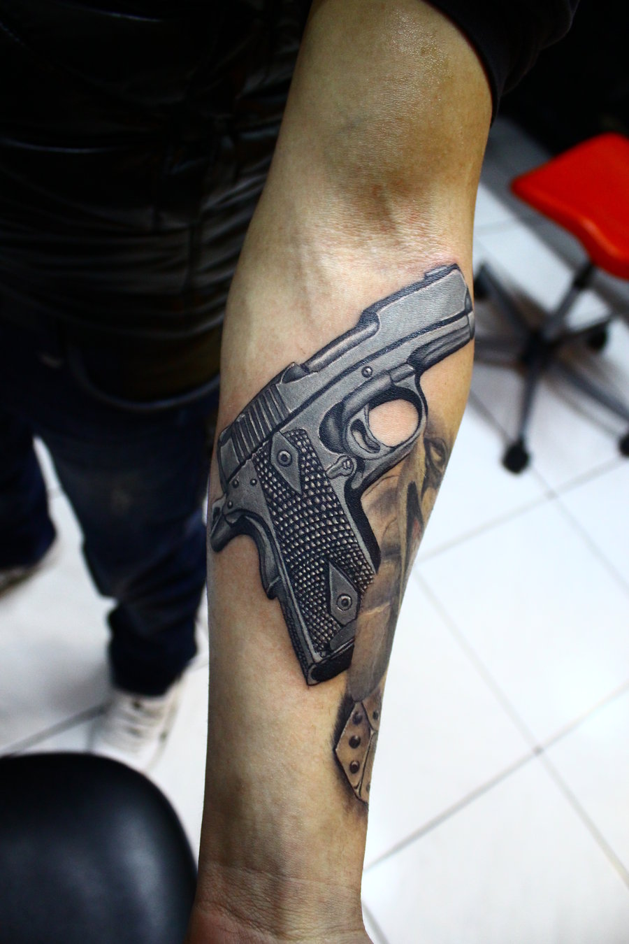 Realistic Gun Tattoo On Forearm