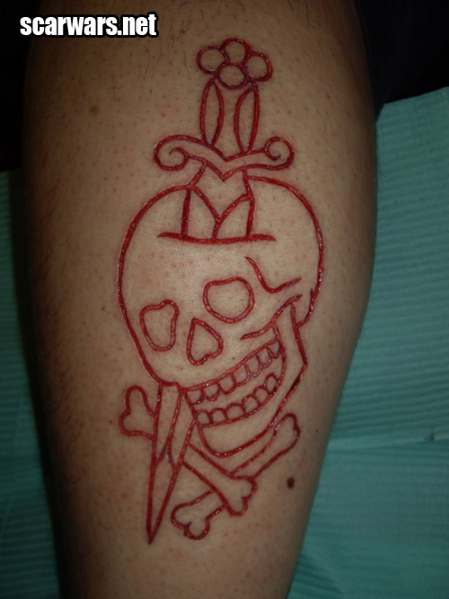 Red Ink Dagger In Skull Tattoo Design
