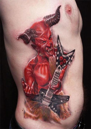 Red Ink Devil With Guitar Tattoo On Side Rib