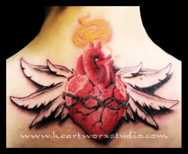 Red Sacred Real Heart With Feathers Tattoo On Upper Back