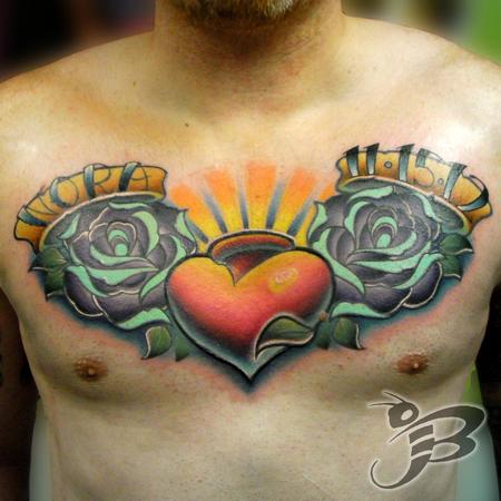 Sacred Heart With Two Roses Tattoo On Man Chest