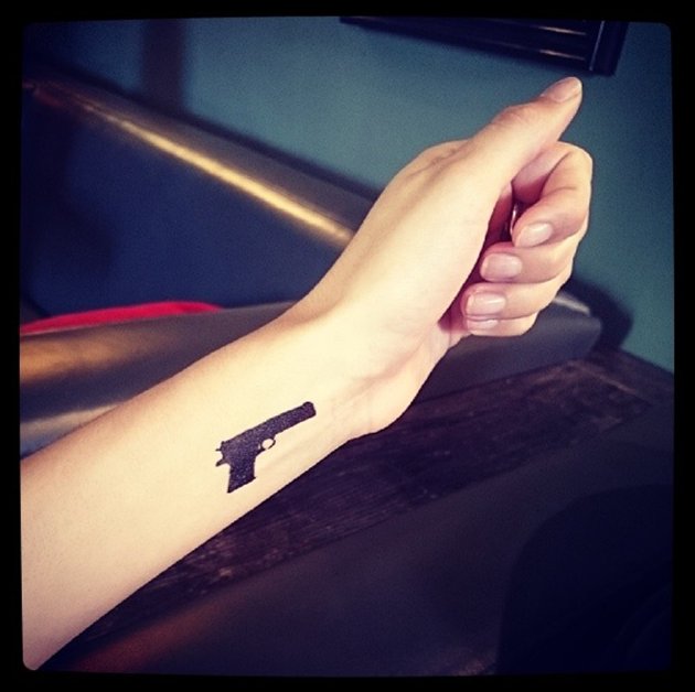 Silhouette Gun Tattoo On Wrist