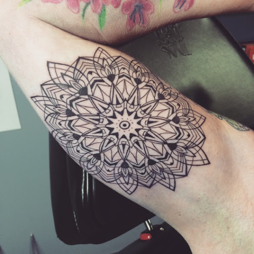 Unique Black Mandala Flower Tattoo On Bicep