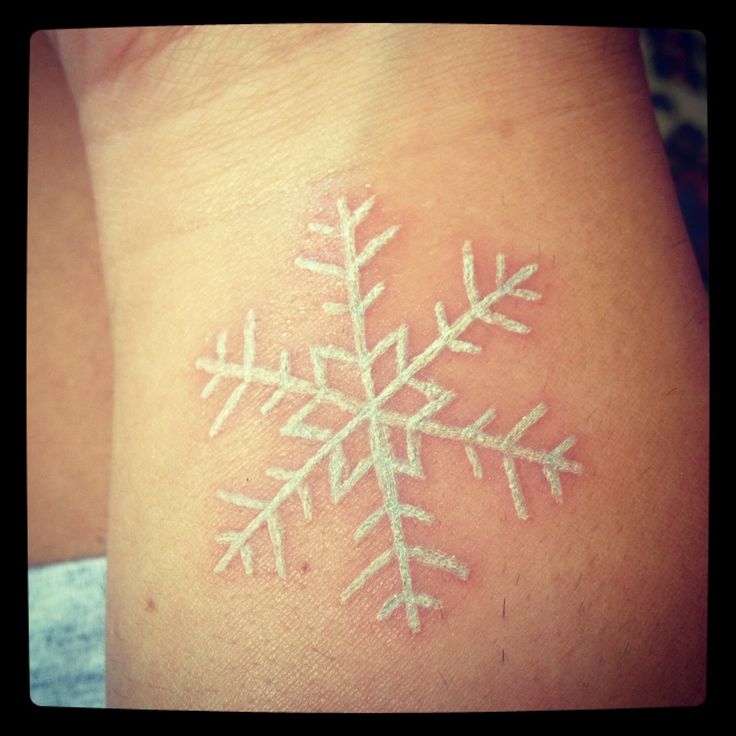 White Ink Snowflake Tattoo Design For Wrist