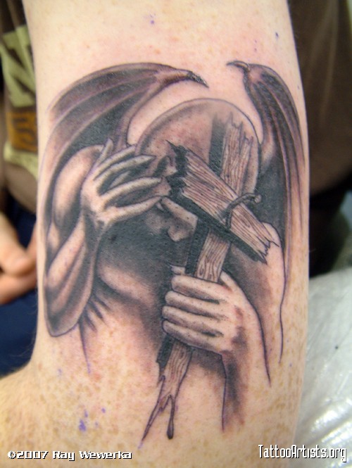 Wooden Cross In Devil Hand Tattoo Design For Sleeve