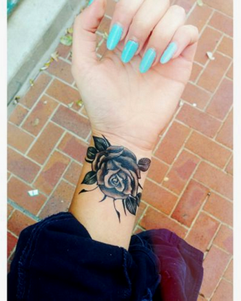 Amazing Black Rose Tattoo On Girl Wrist