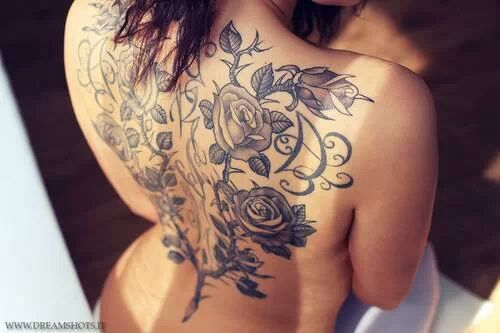 Amazing Black Roses With Leaves Tattoo On Girl Full Back