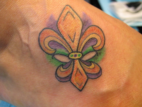 Amazing Mardi Gras Symbol Tattoo Design