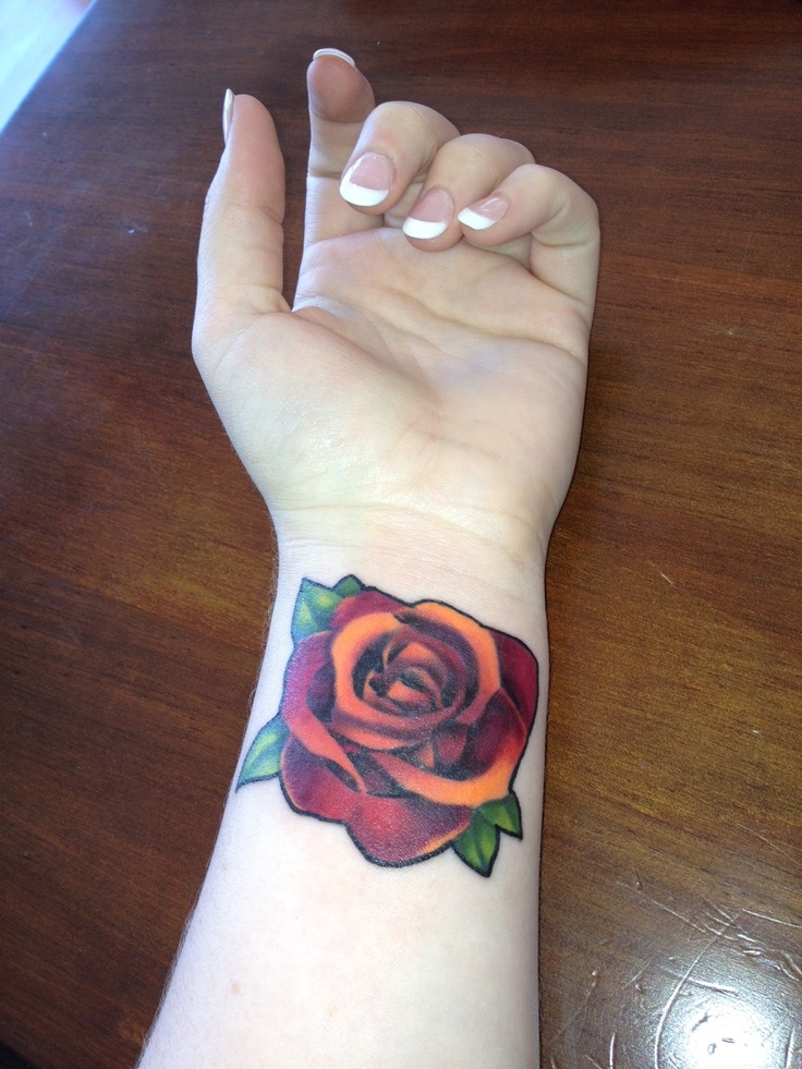 Amazing Orange Rose Tattoo On Girl Wrist