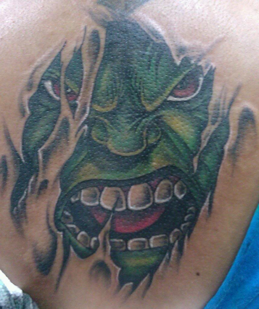 Amazing Ripped Skin Hulk Head Tattoo Design