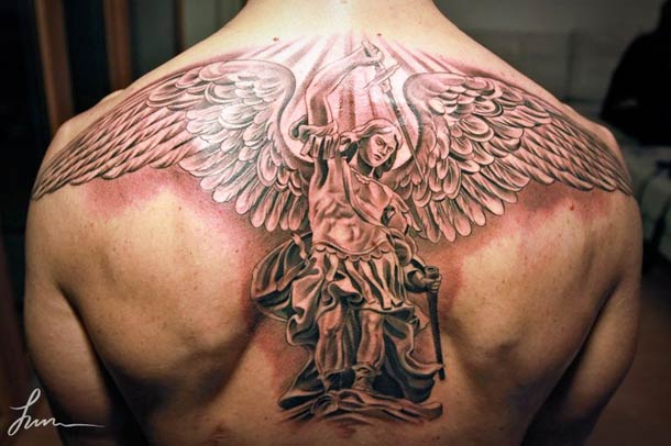 Awesome Greek Angel Tattoo On Man Upper  Back