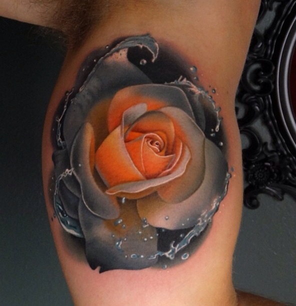 Awesome Grey And Orange Rose Tattoo On Bicep By Andres Acosta