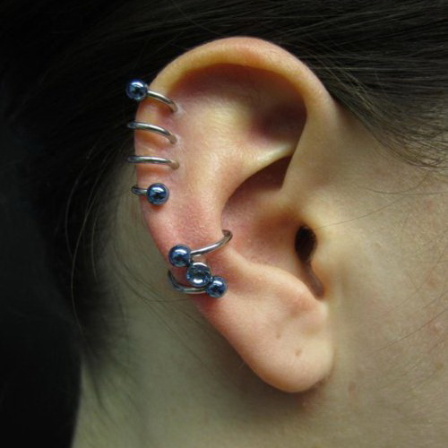 Beautiful Dual Spiral Piercings On Girl Right Ear