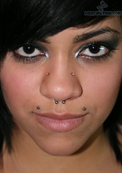 Beautiful Girl With Nose Septum And Dragon Bites Piercing