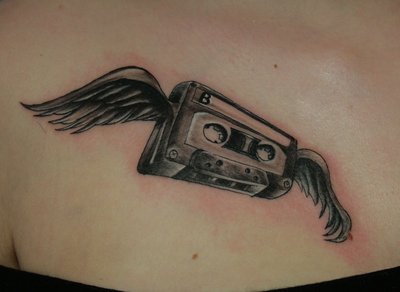 Black And Grey Cassette With Wings Tattoo Design
