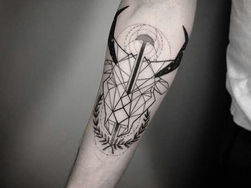 Black Geometric Taurus Head Tattoo On Forearm
