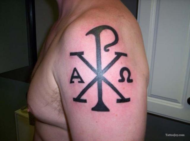 Black Greek Symbol Tattoo On Man Left Shoulder