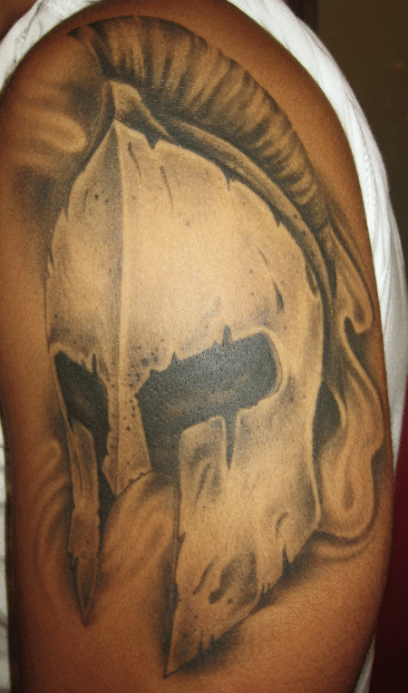 Black Ink 3D Greek Warrior Helmet Tattoo On Left Shoulder