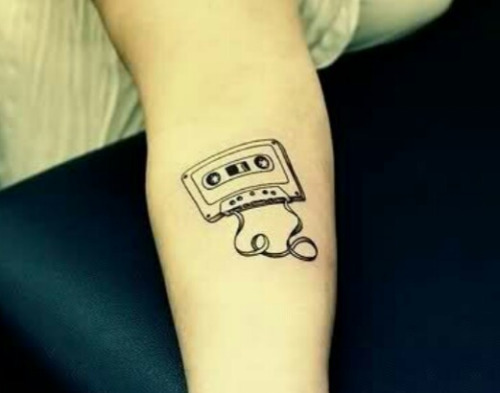 Black Ink Cassette Tattoo On Forearm