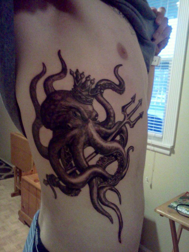 Black Ink Greek Octopus With Trident Tattoo On Man Side Rib