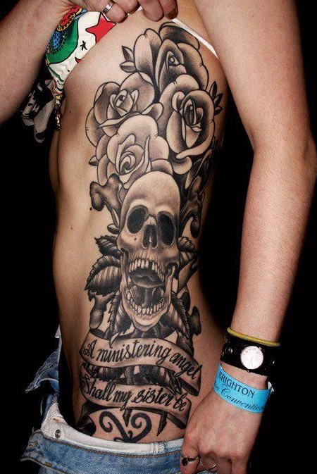Black Ink Skull With Banner And Roses Tattoo On Girl Side Rib
