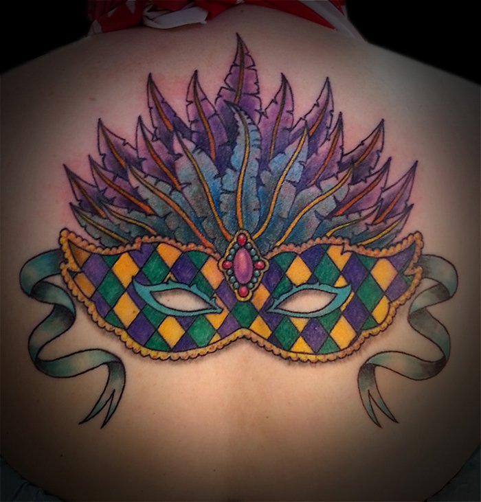 Colorful Mardi Gras Eye Mask Tattoo On Upper Back