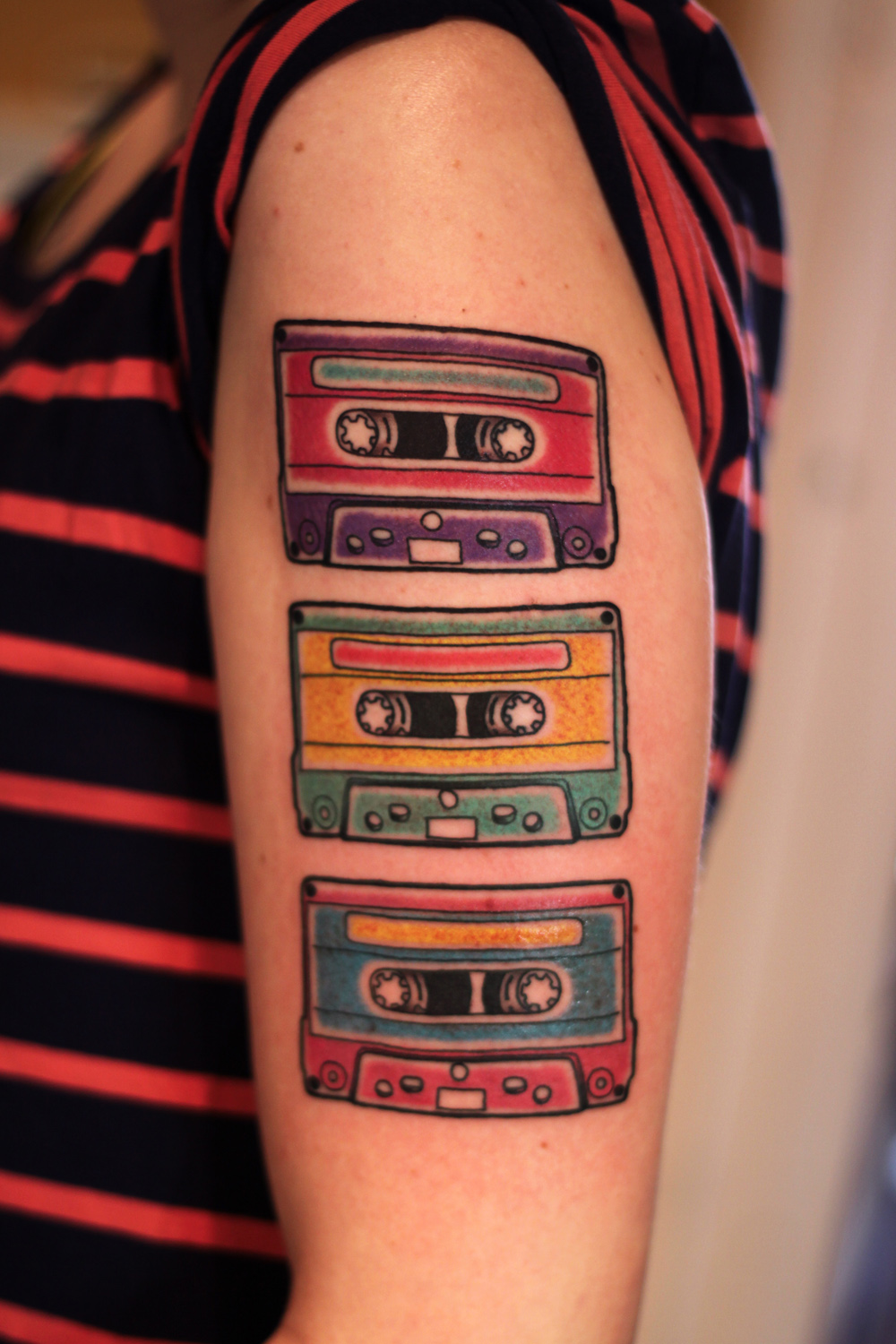 Colorful Three Cassettes Tattoo On Girl Left Half Sleeve