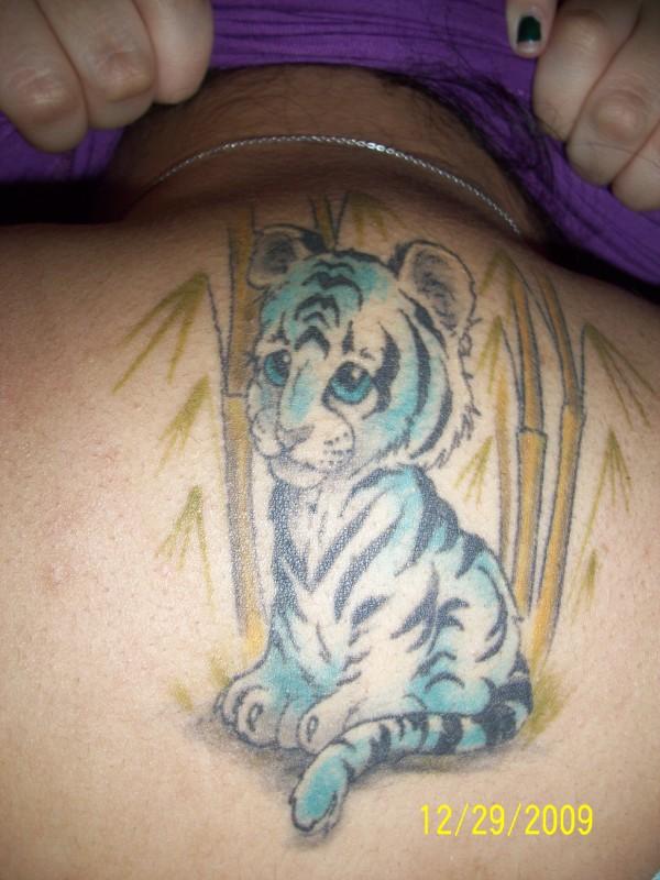 Cute Tiger Cub Tattoo On Man Upper Back