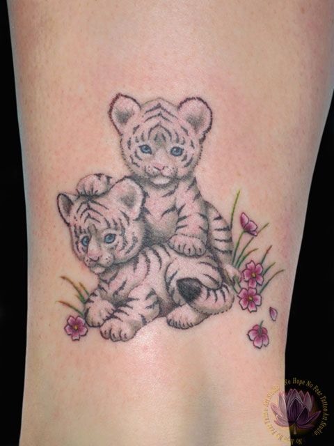 Cute Two Tiger Cubs With Flowers Tattoo Design