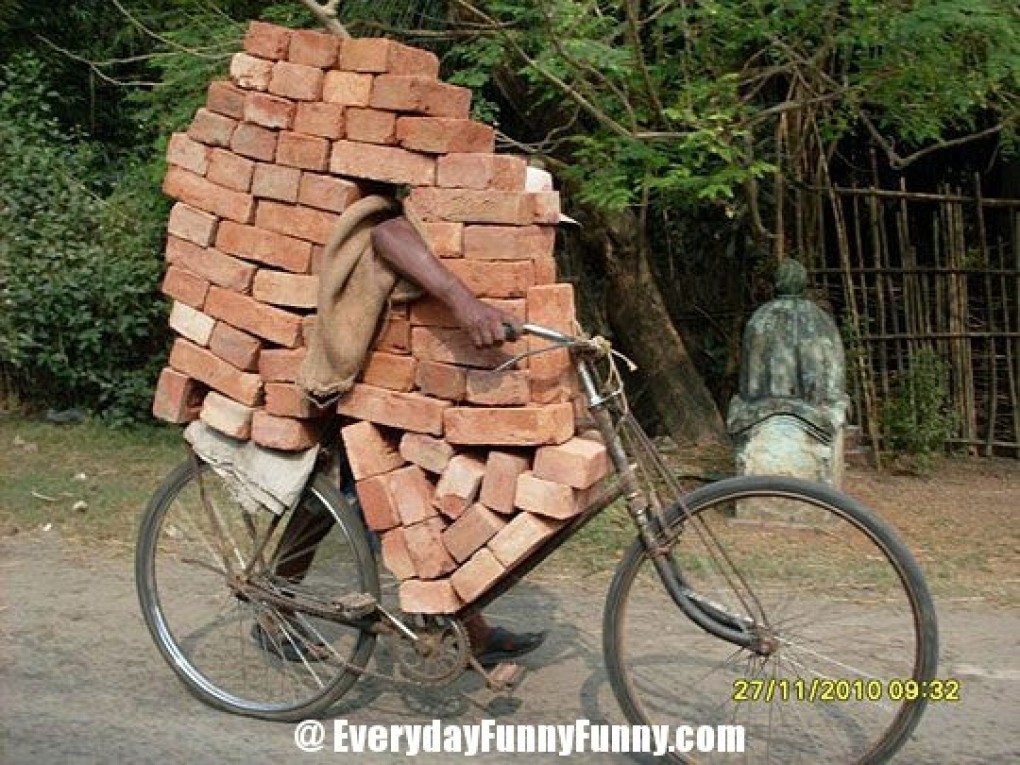 Funny Amazing Carrying Bricks On Bicycle
