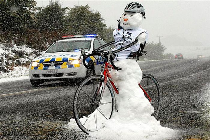 Funny Snowman On Bicycle