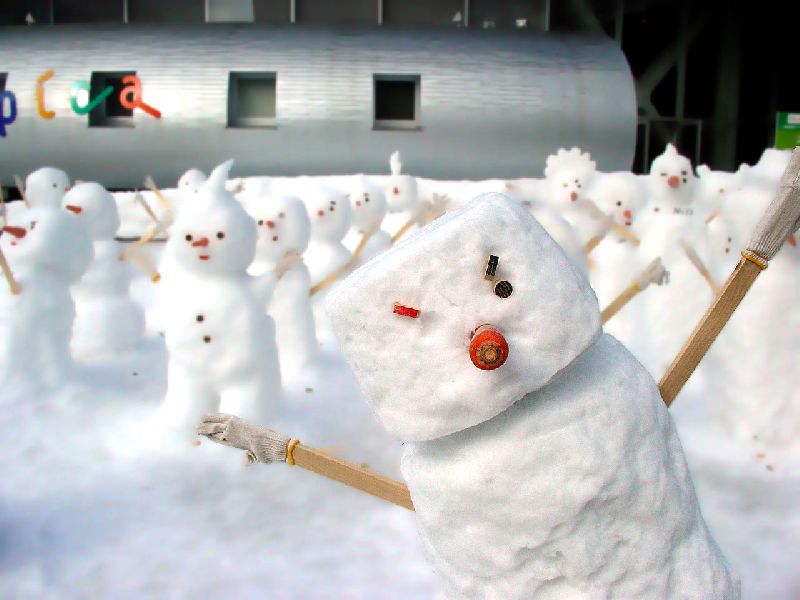 Funny Snowmen Posing For Picture