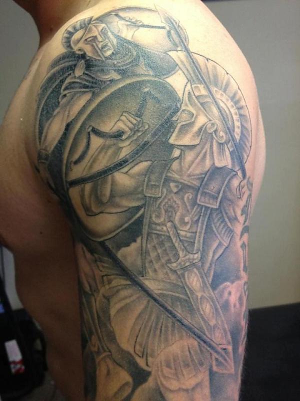 Grey Ink Greek Warrior Tattoo On Man Left Half Sleeve