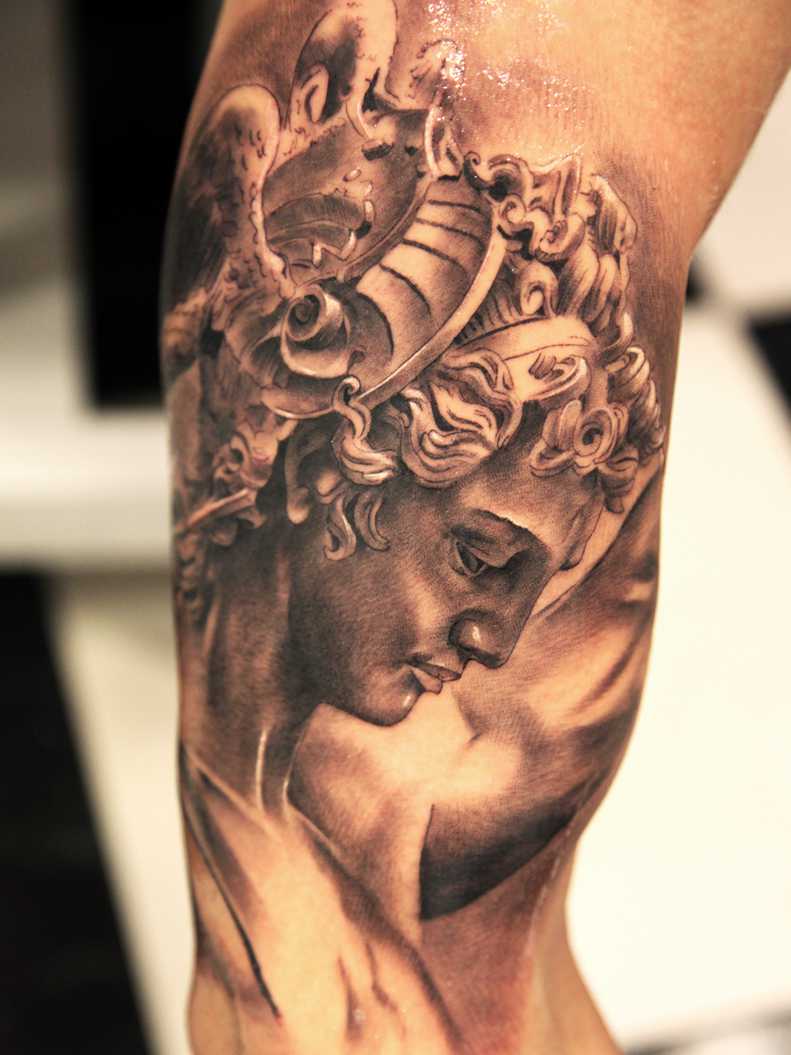 Grey Ink Greek Women Tattoo On Bicep