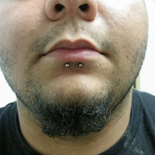 Guy With Dolphin Bites Piercing On His Lower Lip