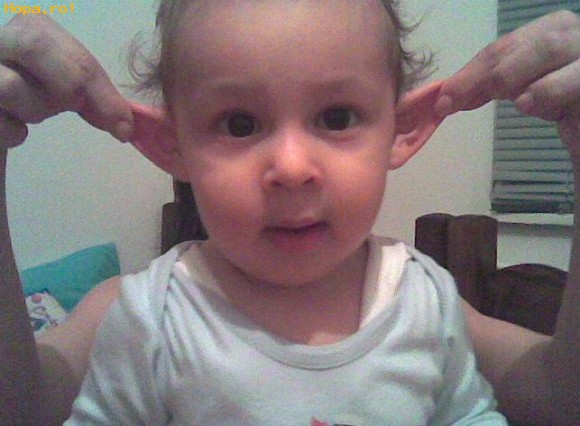 Kid With Pulling Ears Funny Picture