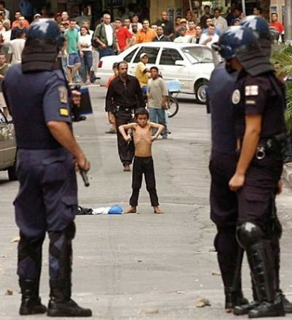 Little Boy Showing Muscles To Cops Funny Image