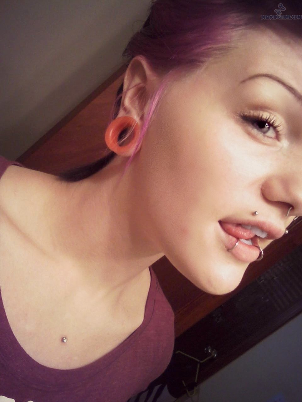 Lobe Stretching And Canine Bites Piercing Picture For Girls