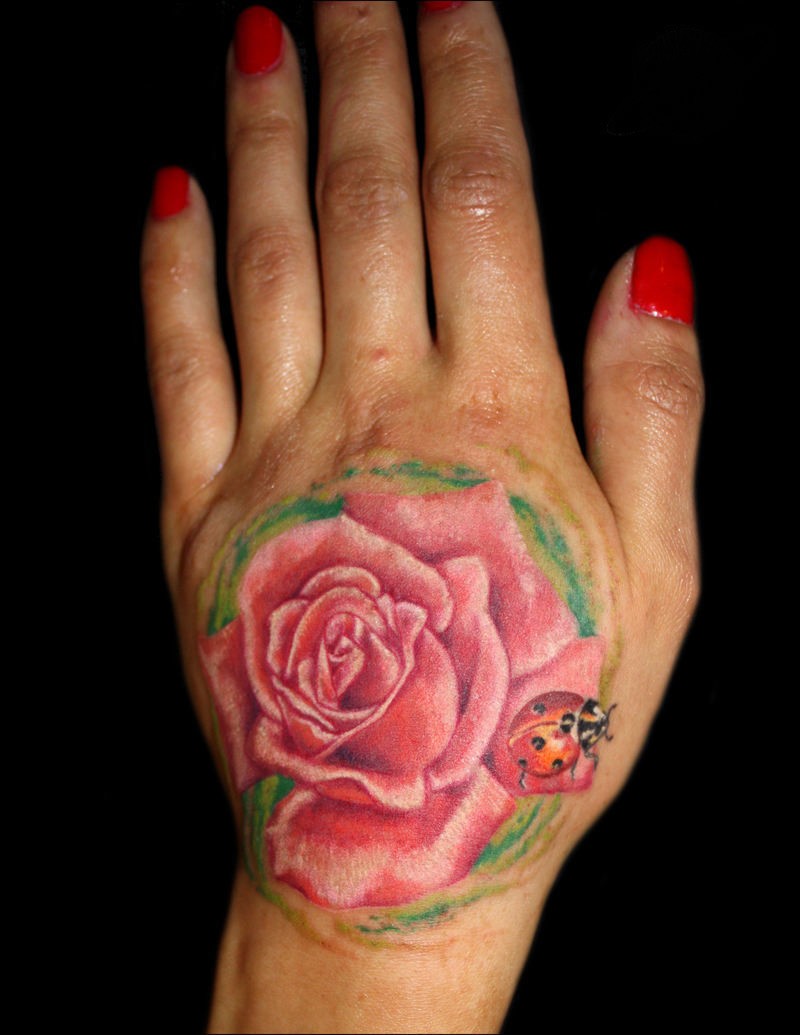 Pink Rose With Lady Bug Tattoo On Girl Hand