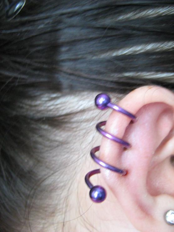 Purple Spiral Piercing On Girl Right Ear