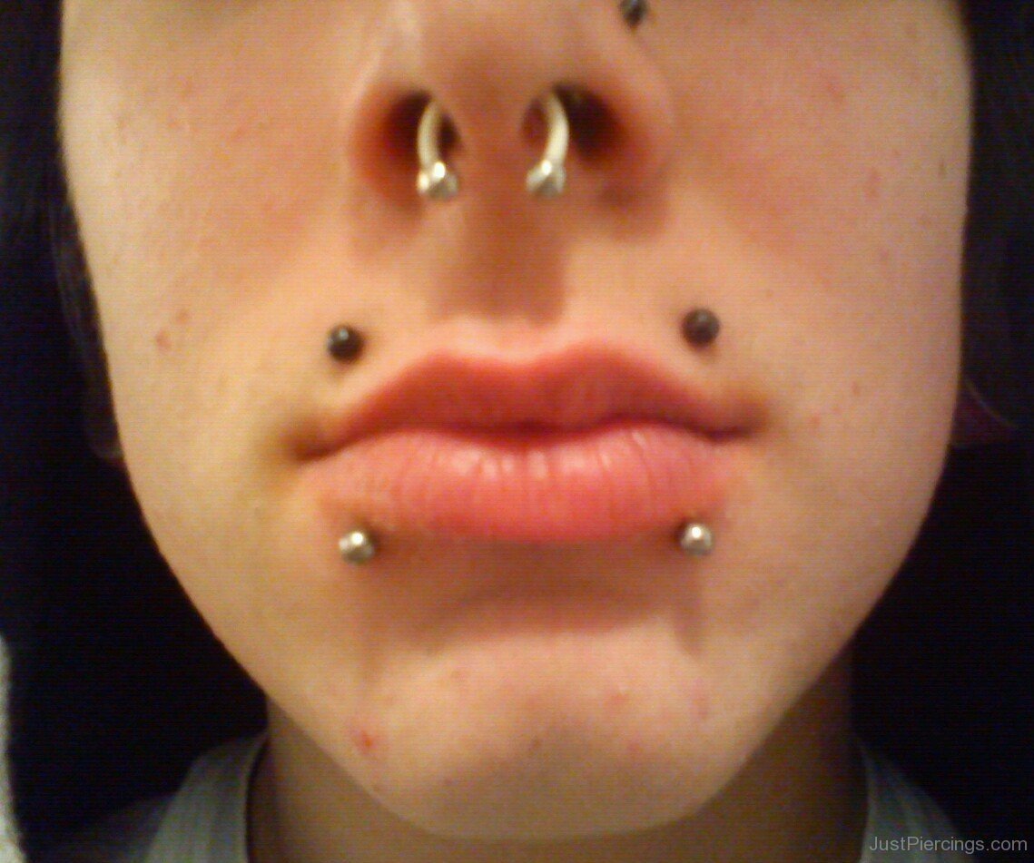 Septum Piercing With Circular Barbell And Canine Bites Piercing Picture