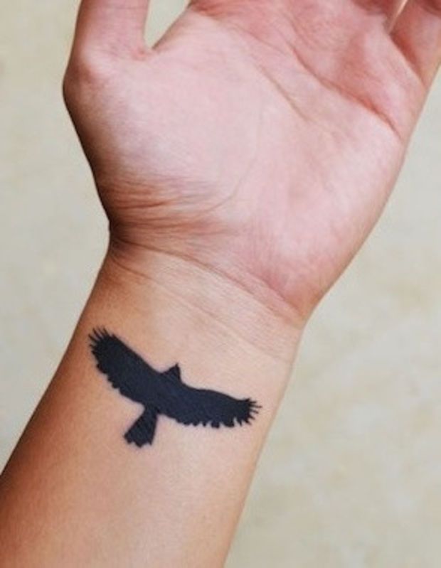 Silhouette Flying Hawk Tattoo On Wrist