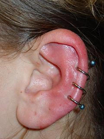 Spiral Piercing On Girl Left Ear