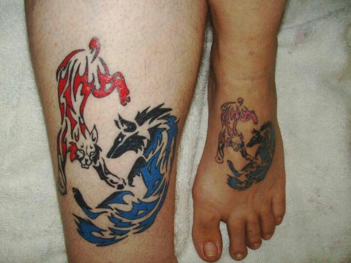 Tribal Wolf And Bobcat Tattoo On Thigh And Foot