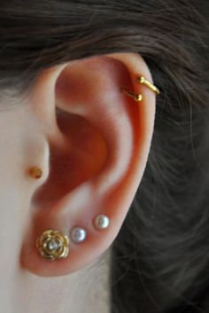 Triple Ear Lobes And Spiral Piercing On Left Ear