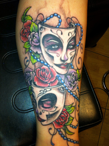 Two Mardi Gras Mask With Flowers Tattoo Design For Leg
