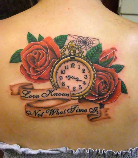 Two Orange Roses With Pocket Watch And Banner Tattoo On Girl Upper Back