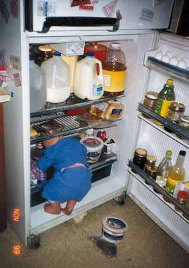 Hungry Kid Inside Refrigerator Funny Image